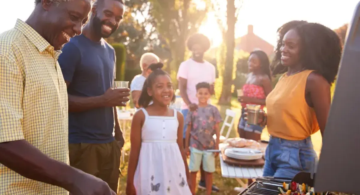 Father and family grilling together.