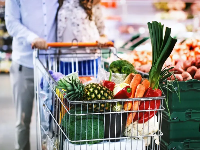 Grocery cart going through Cash Saver.